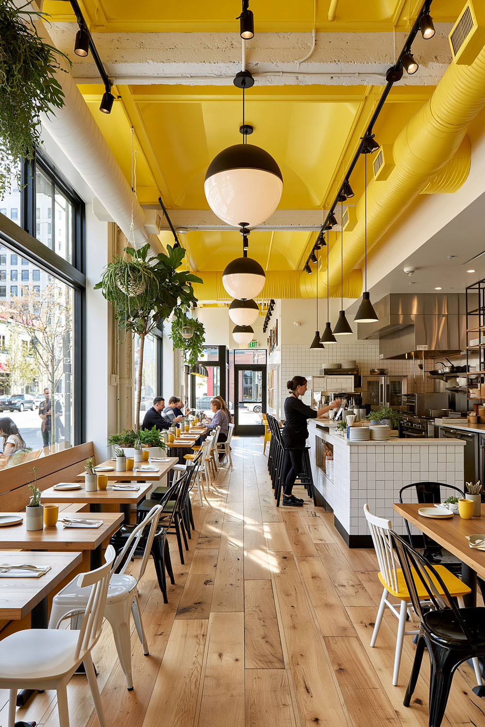 Modern restaurant interior with yellow accents